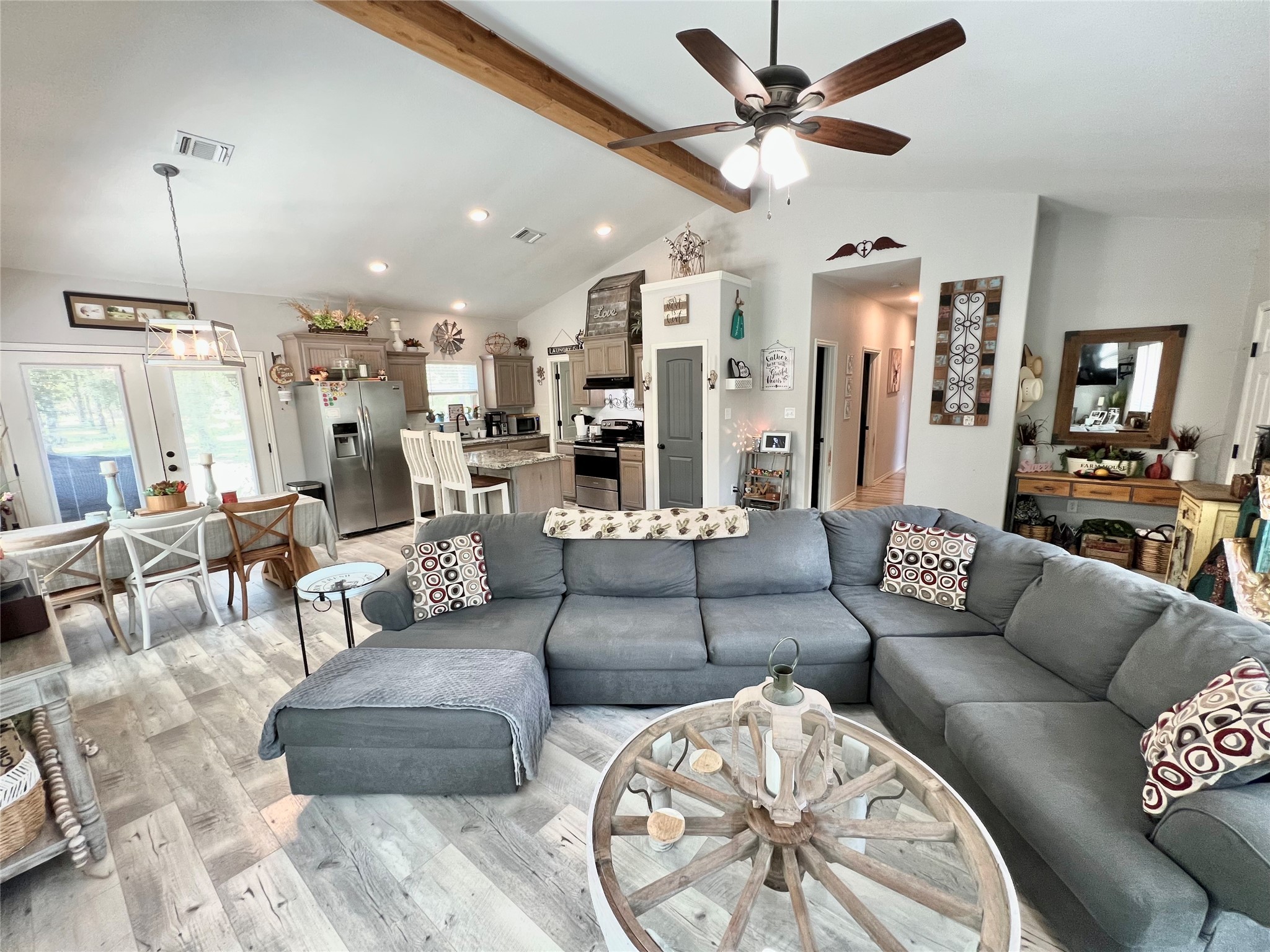 22740 Brazos Circle Damon, TX 77430 - Photo 7 of 30 a living room with furniture and a chandelier