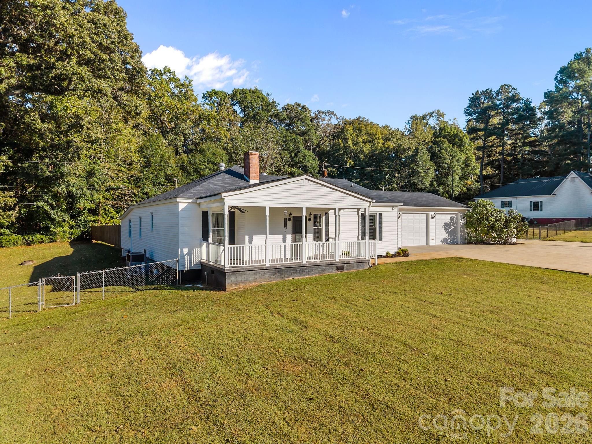 1614 Old Nation Road Fort Mill, SC 29715 - Photo 2 of 47 a front view of a house with yard and swimming pool