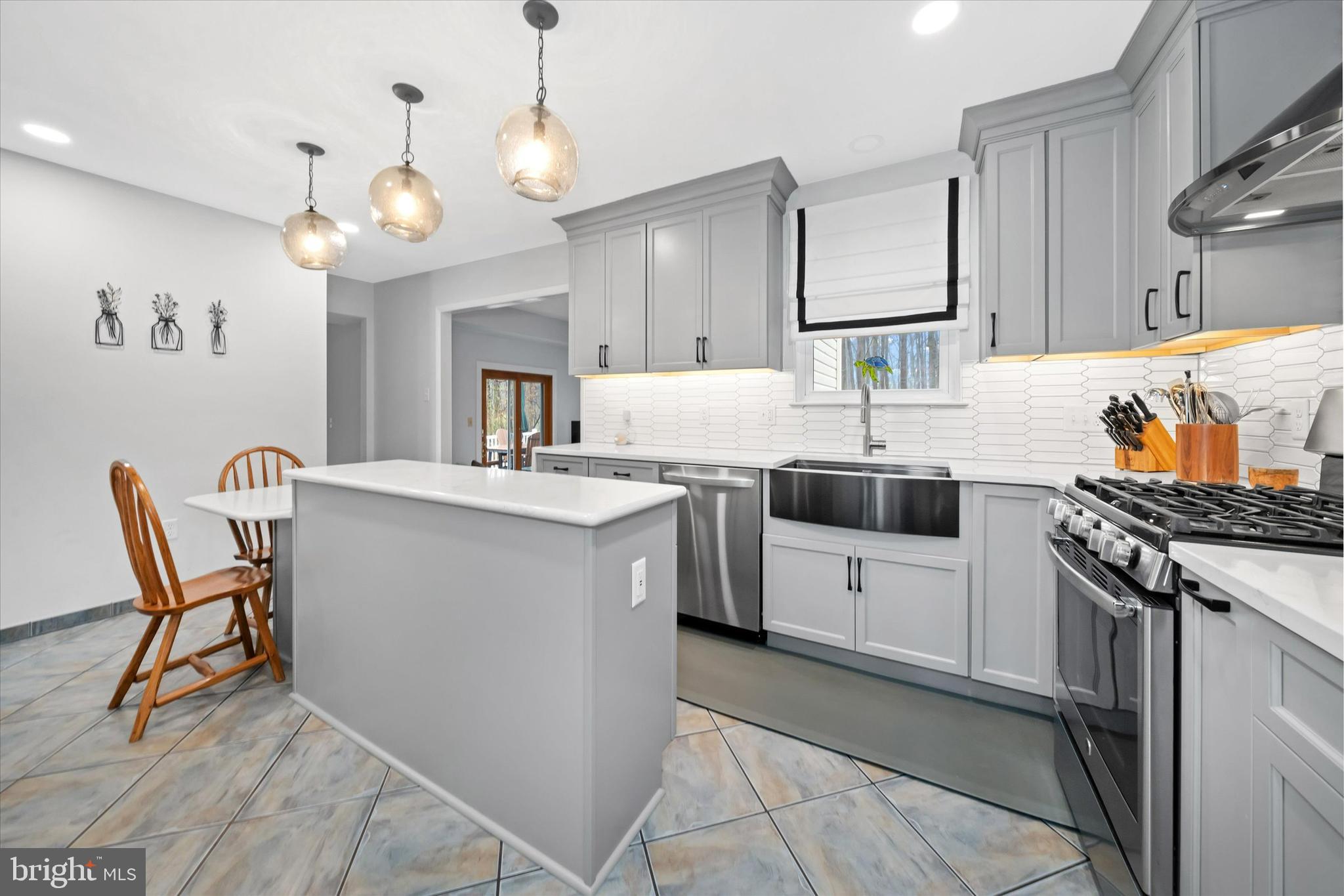 710 Fox Chase Circle Bear, DE 19701 - Photo 11 of 55 a kitchen with a sink stove and white cabinets
