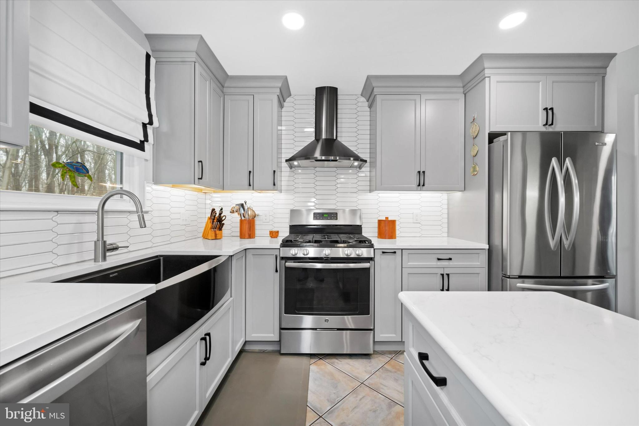 710 Fox Chase Circle Bear, DE 19701 - Photo 12 of 55 a kitchen with a stove and a refrigerator