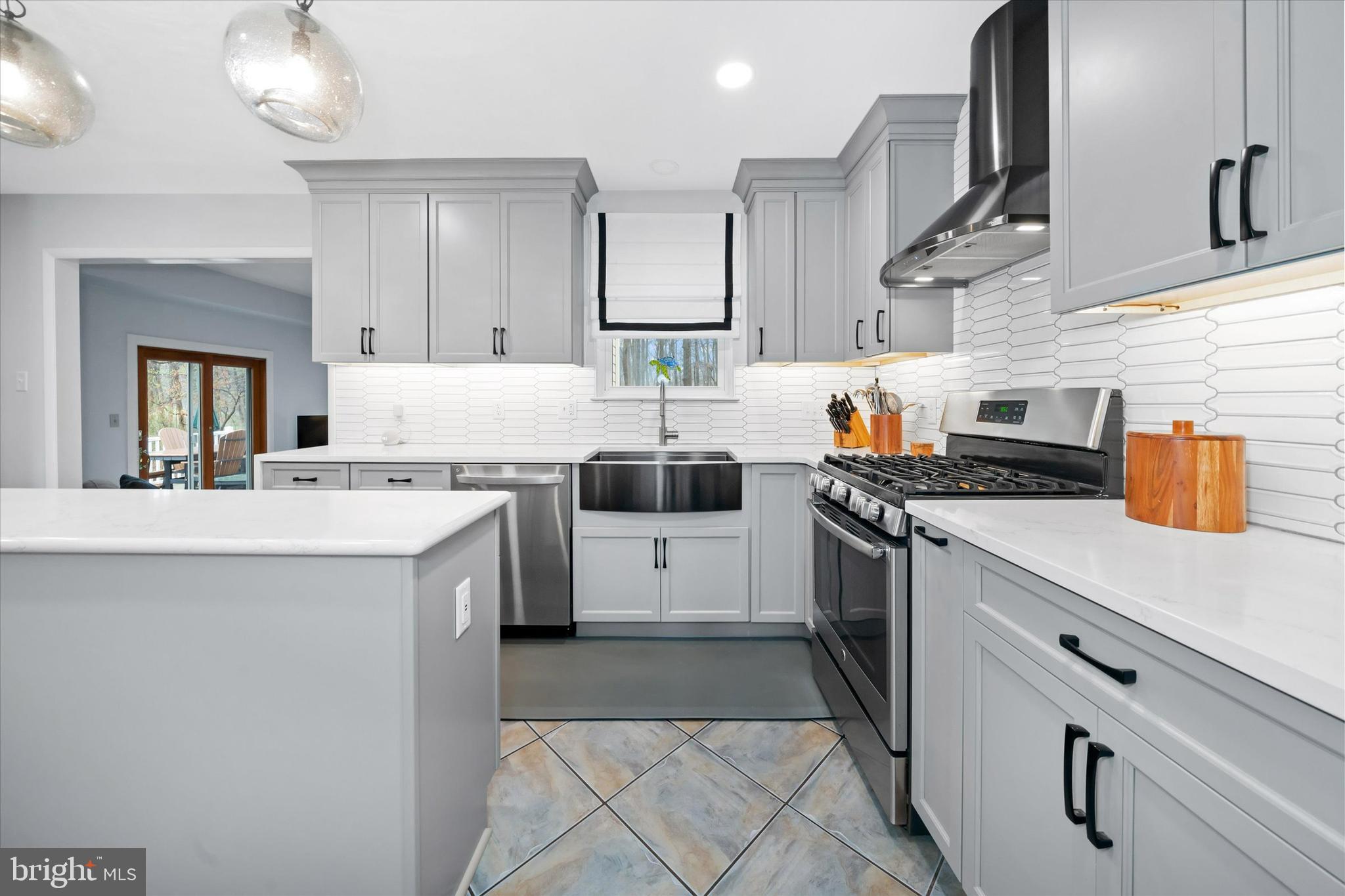 710 Fox Chase Circle Bear, DE 19701 - Photo 14 of 55 a kitchen with stainless steel appliances a sink stove and cabinets