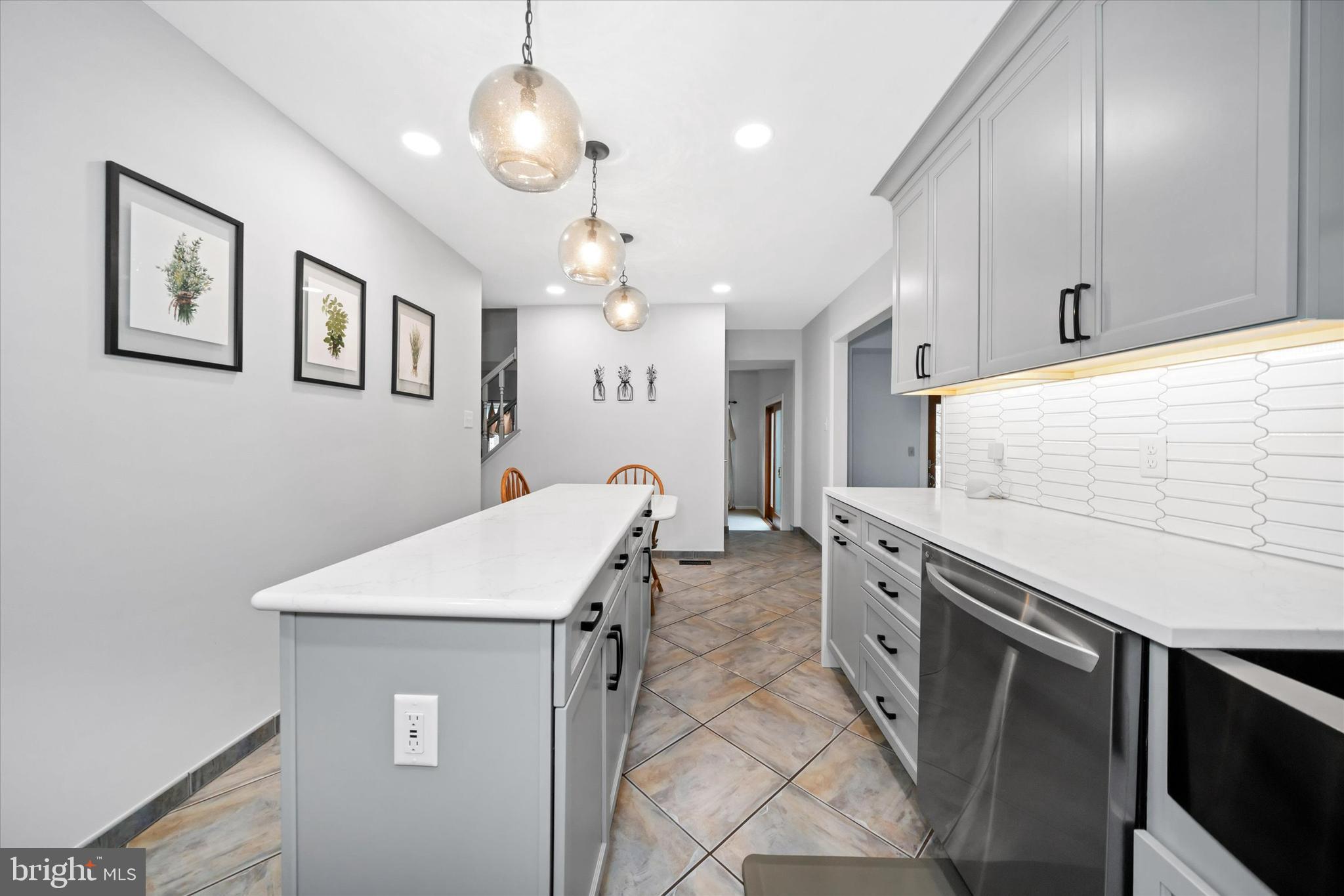 710 Fox Chase Circle Bear, DE 19701 - Photo 15 of 55 a kitchen with stainless steel appliances granite countertop a stove a sink and a refrigerator