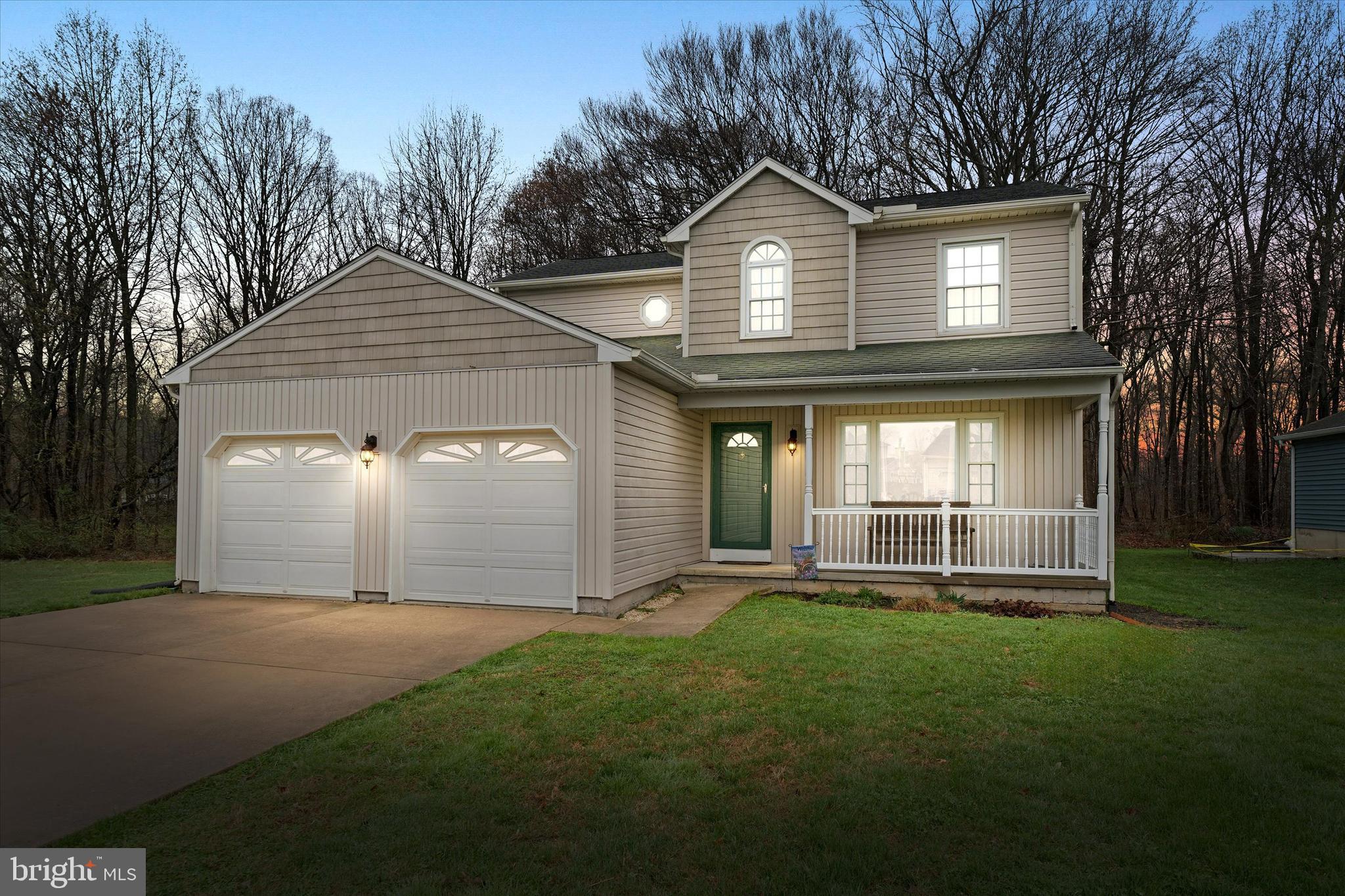 710 Fox Chase Circle Bear, DE 19701 - Photo 2 of 55 a front view of a house with a yard and garage