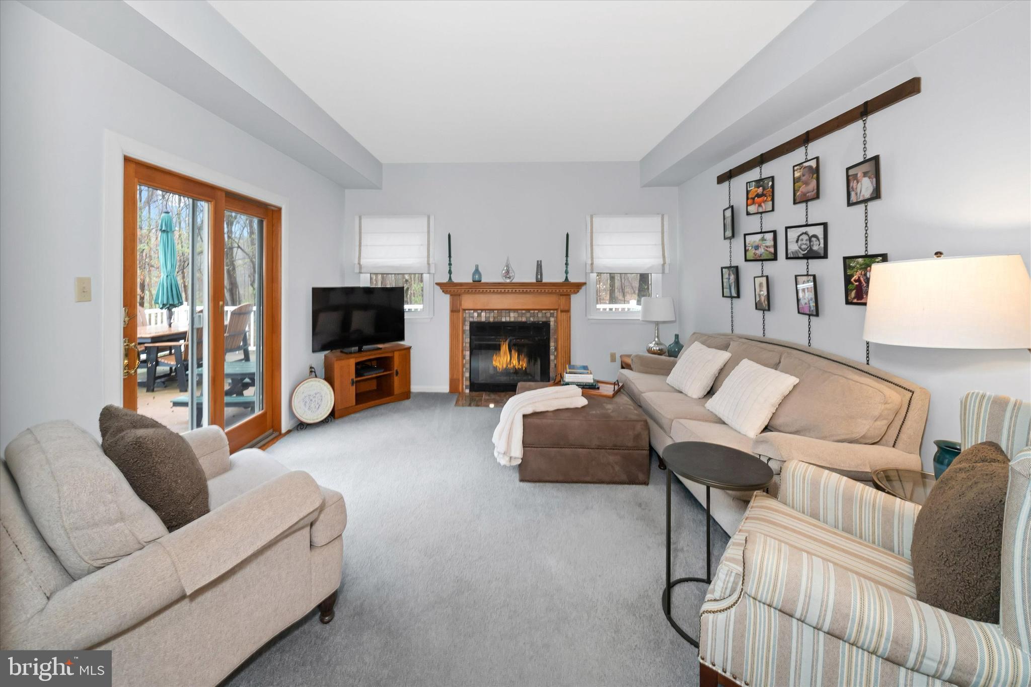 710 Fox Chase Circle Bear, DE 19701 - Photo 21 of 55 a living room with furniture fireplace and a window