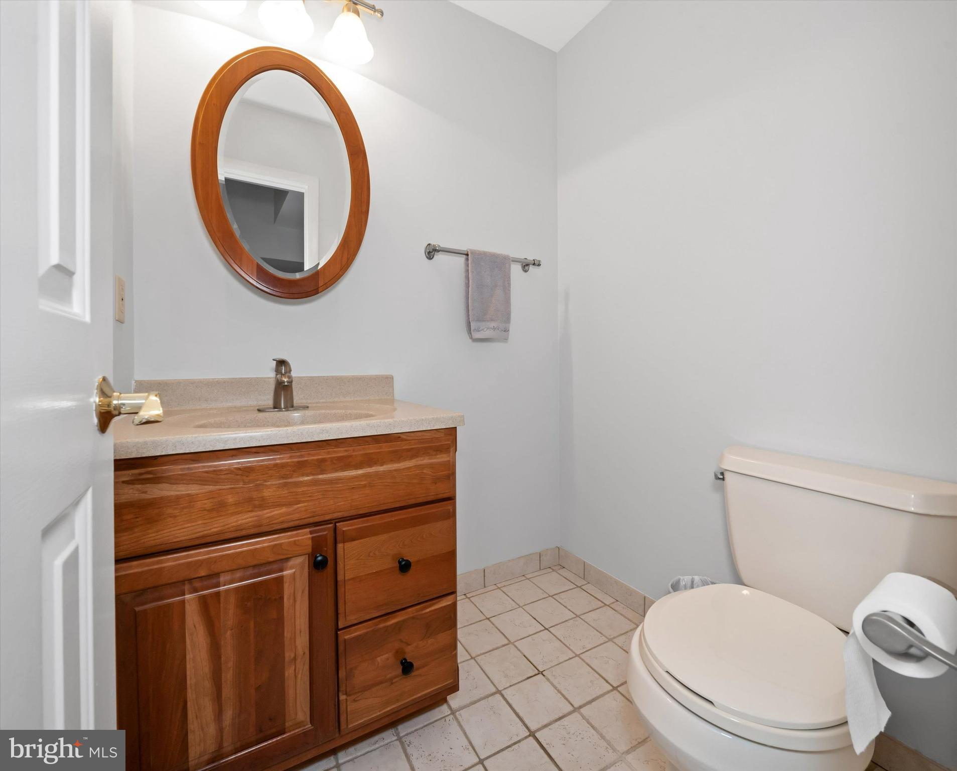 710 Fox Chase Circle Bear, DE 19701 - Photo 32 of 55 a bathroom with a toilet a sink and a mirror