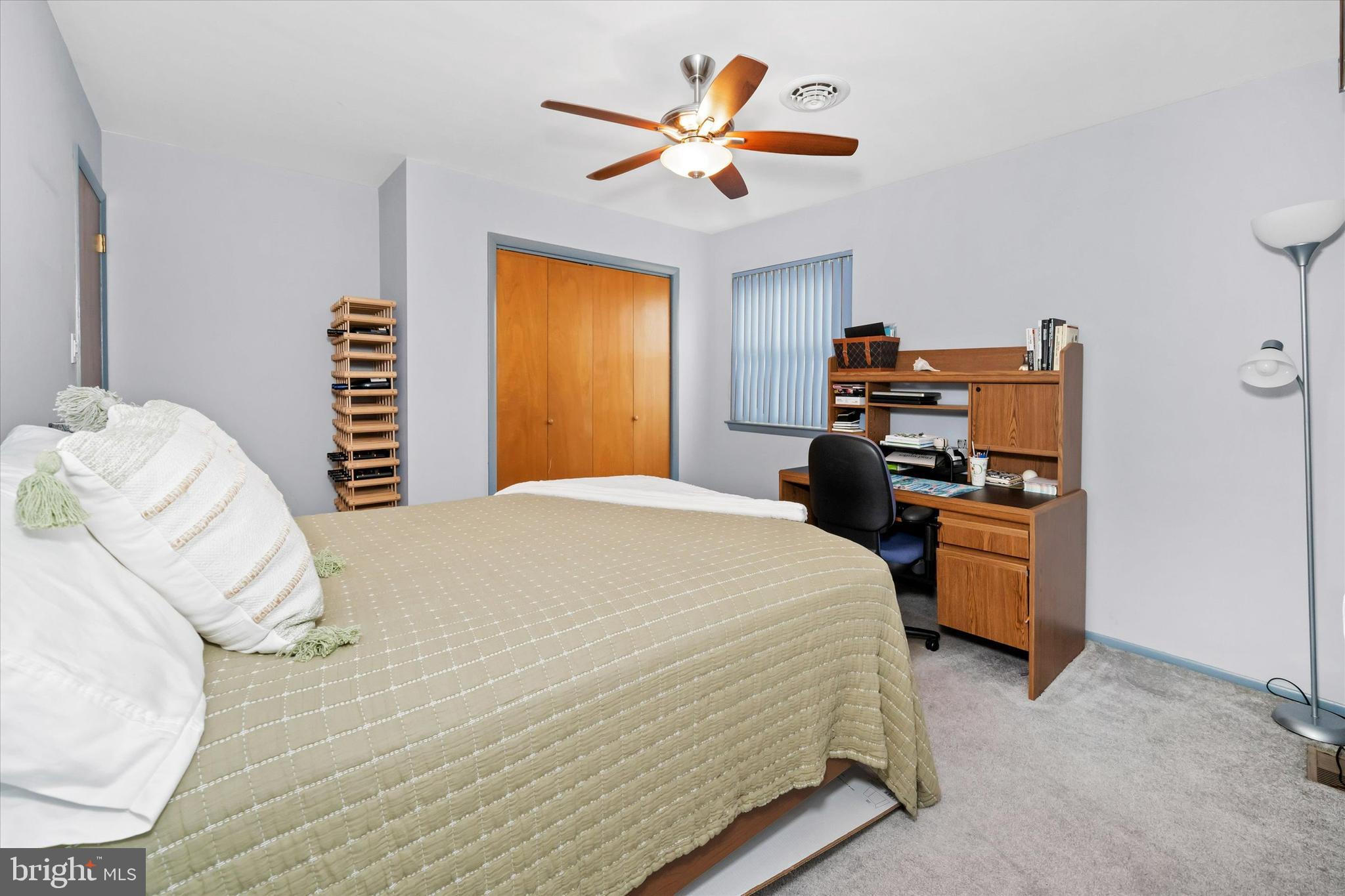 710 Fox Chase Circle Bear, DE 19701 - Photo 35 of 55 a bedroom with a bed and a chandelier