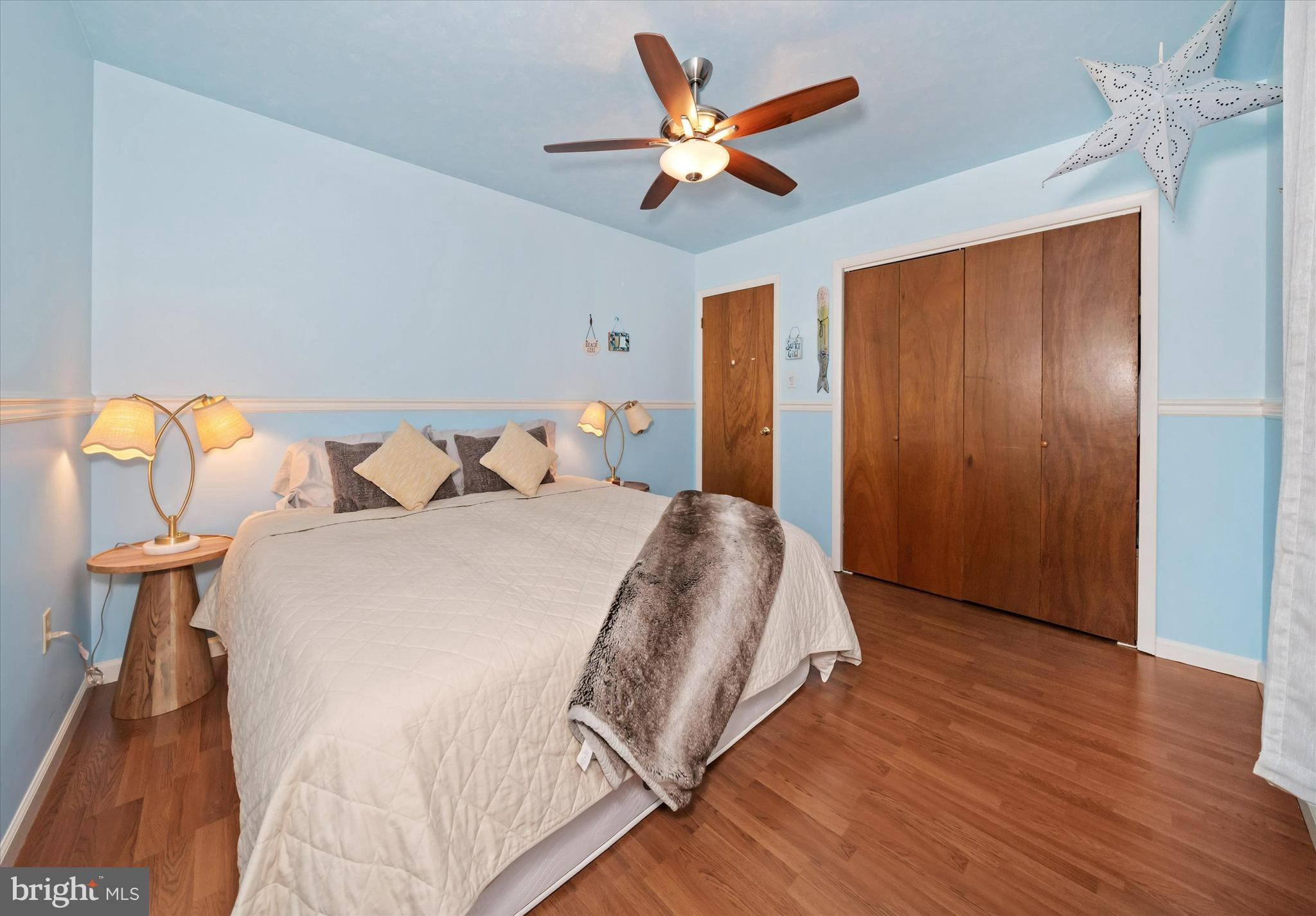 710 Fox Chase Circle Bear, DE 19701 - Photo 37 of 55 a bedroom with a large bed and a chandelier