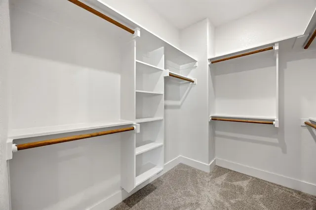 a view of an empty walk in closet