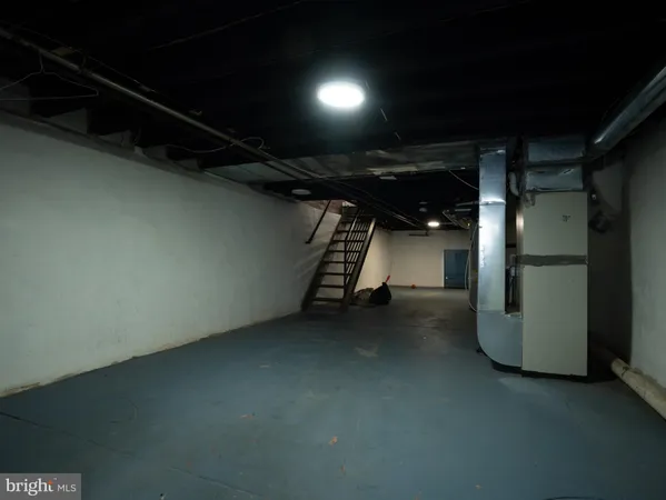 a view of an empty room with a fireplace