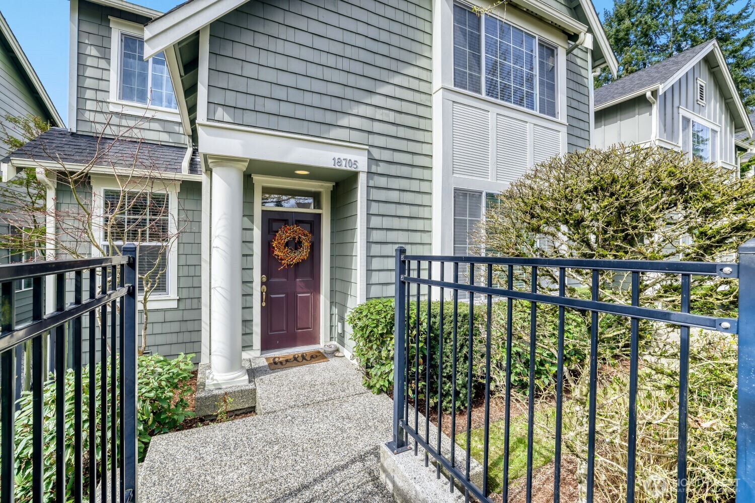 18705 101st Avenue Northeast, Unit 3 Bothell, WA 98011 - Photo 2 of 31 a front view of a house with a porch