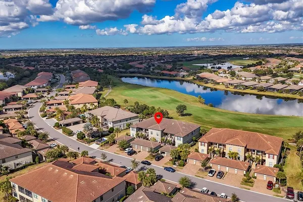an aerial view of a house with a ocean view