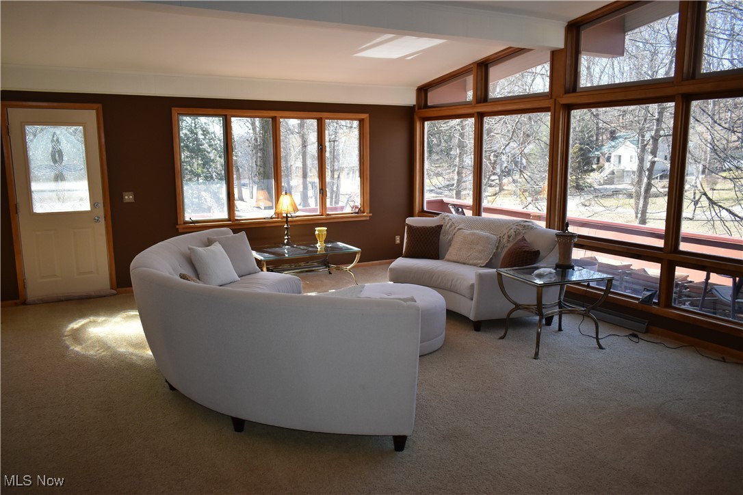 735 Sheridan Road Coshocton, OH 43812 - Photo 13 of 34 Carpeted living room with vaulted ceiling