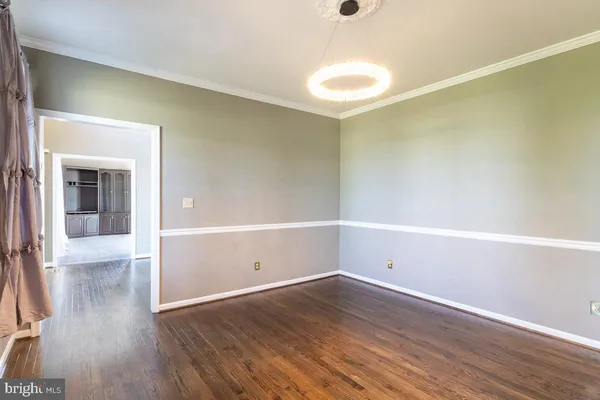 a kitchen with stainless steel appliances granite countertop a refrigerator a stove microwave and cabinets