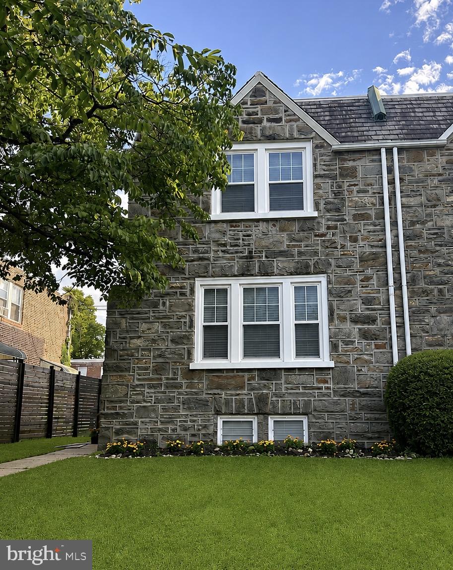 820 Kerper Street Philadelphia, PA 19111 - Photo 2 of 2 Charming stone facade with lush greenery.