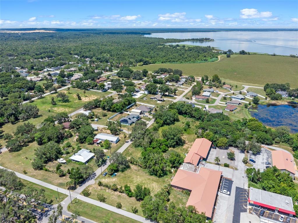 8th Street Montverde, FL 34756 - Photo 16 of 19 an aerial view of a houses with a yard and lake view