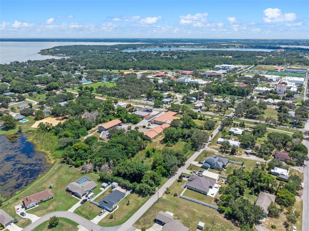 8th Street Montverde, FL 34756 - Photo 18 of 19 an aerial view of residential houses with outdoor space and trees