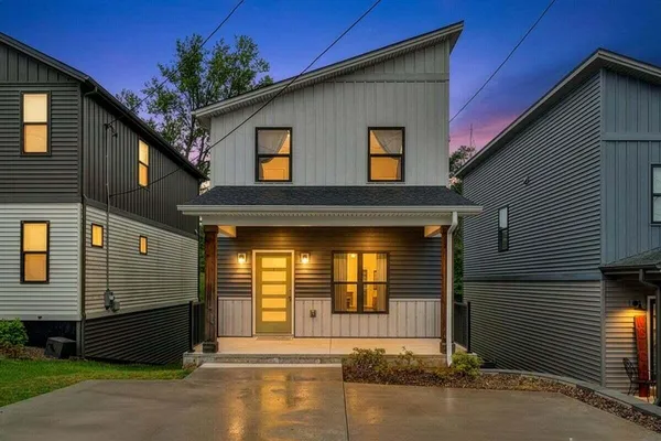 a front view of a house with a garage