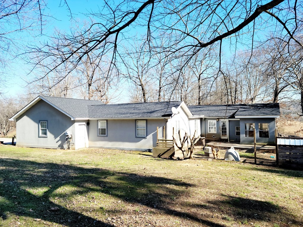 493 Northridge Drive Decatur, TN 37322 - Photo 10 of 43 a front view of a house with garden yard and sitting area