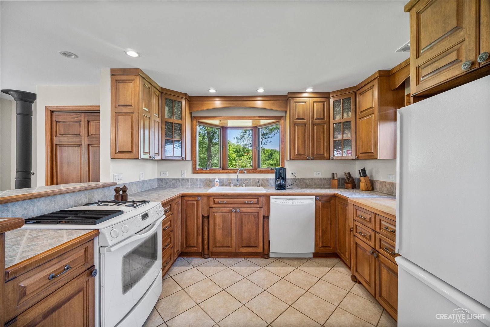 2075 North 4071st Road Sheridan, IL 60551 - Photo 8 of 22 a kitchen with a sink stove and cabinets