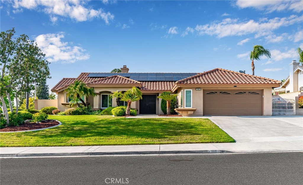 1881 Apostle Lane Riverside, CA 92506 - Photo 1 of 1 a front view of a house with a yard and potted plants