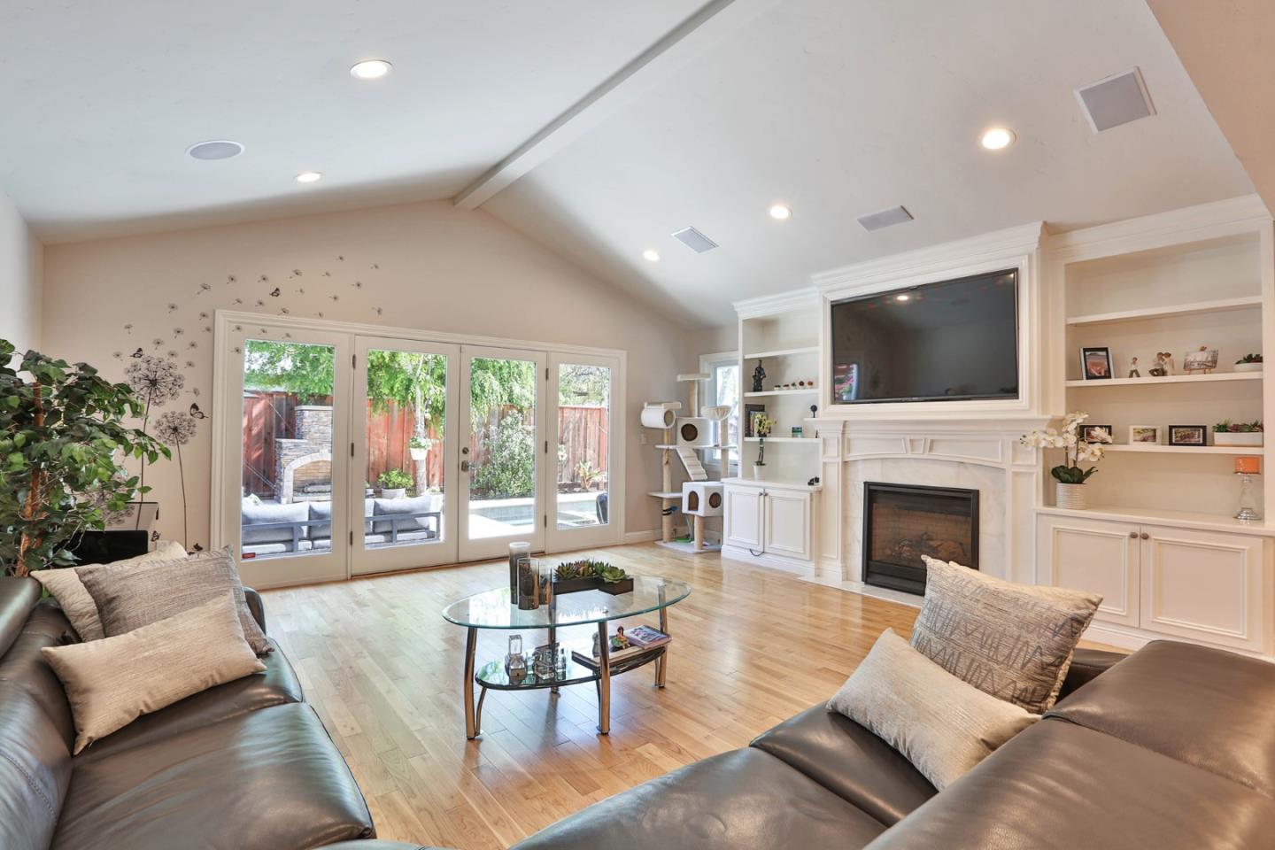 1053 Wallace Drive San Jose, CA 95120 - Photo 11 of 36 a living room with furniture fireplace and a large window