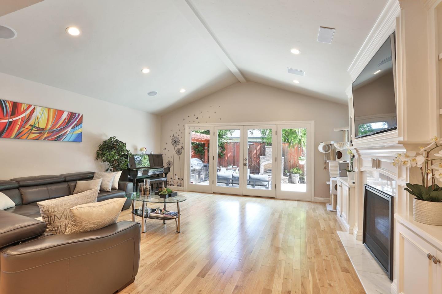 1053 Wallace Drive San Jose, CA 95120 - Photo 12 of 36 a living room with furniture and a wooden floor
