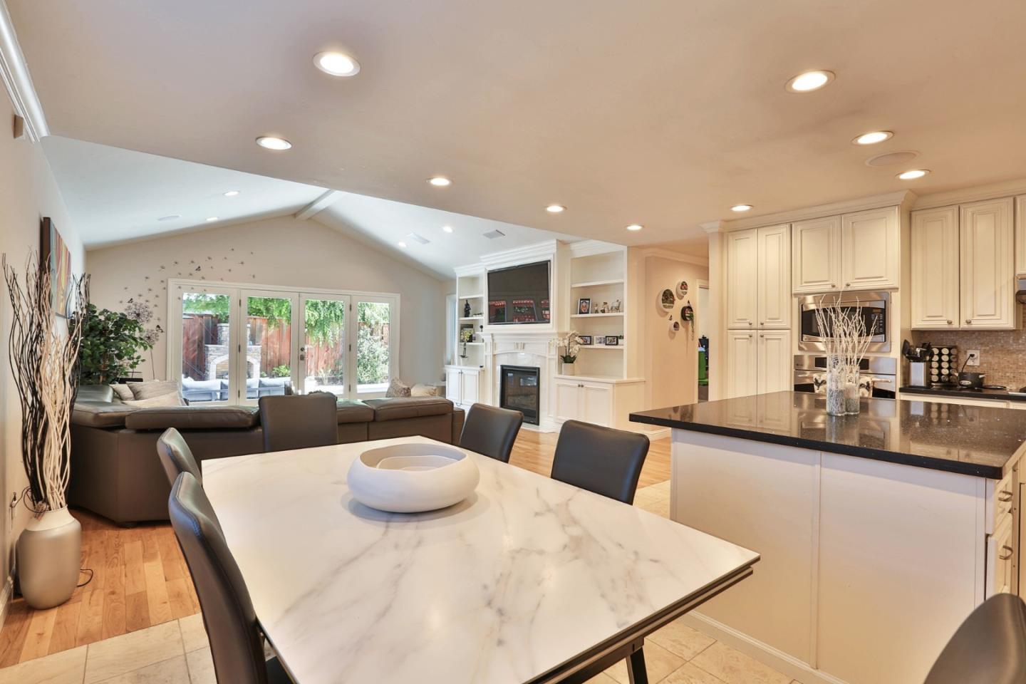 1053 Wallace Drive San Jose, CA 95120 - Photo 14 of 36 a large kitchen with a table and chairs