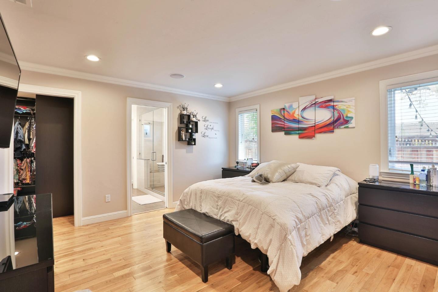 1053 Wallace Drive San Jose, CA 95120 - Photo 17 of 36 a bedroom with a bed and a painting on the wall