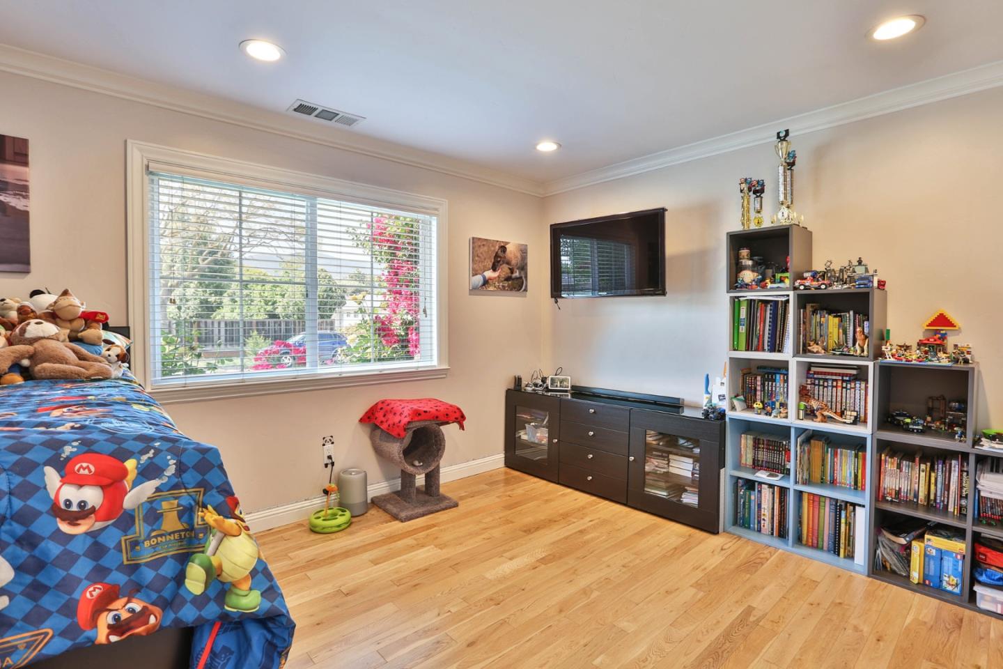 1053 Wallace Drive San Jose, CA 95120 - Photo 23 of 36 a bedroom with a bed dresser and a flat screen tv