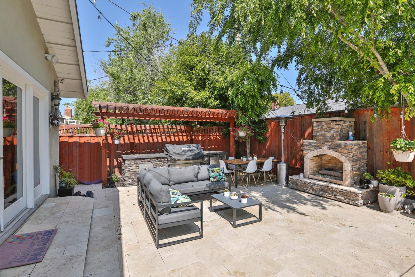 1053 Wallace Drive San Jose, CA 95120 - Photo 26 of 36 a view of backyard with outdoor seating and trees