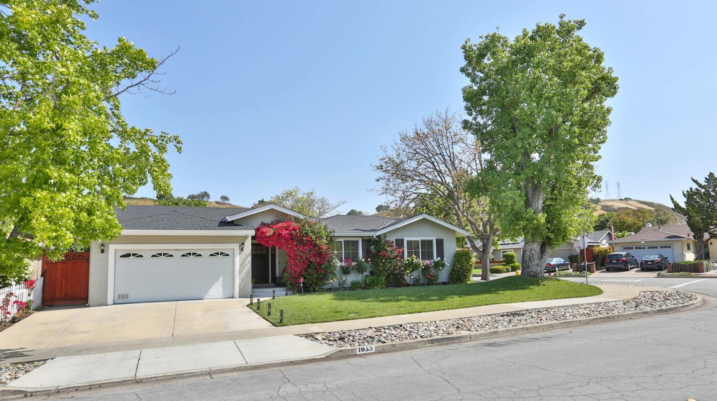 1053 Wallace Drive San Jose, CA 95120 - Photo 3 of 36 a front view of a house with a yard and garage