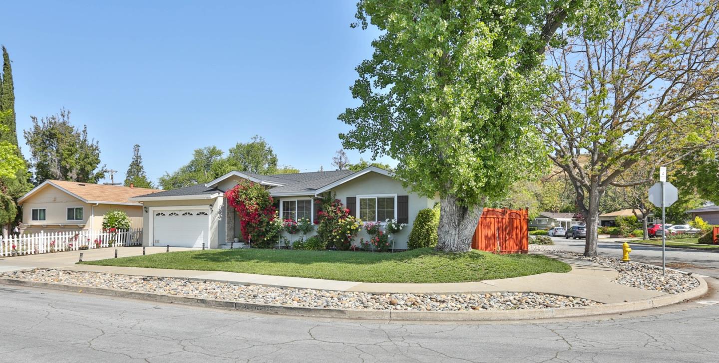 1053 Wallace Drive San Jose, CA 95120 - Photo 4 of 36 a front view of a house with a garden