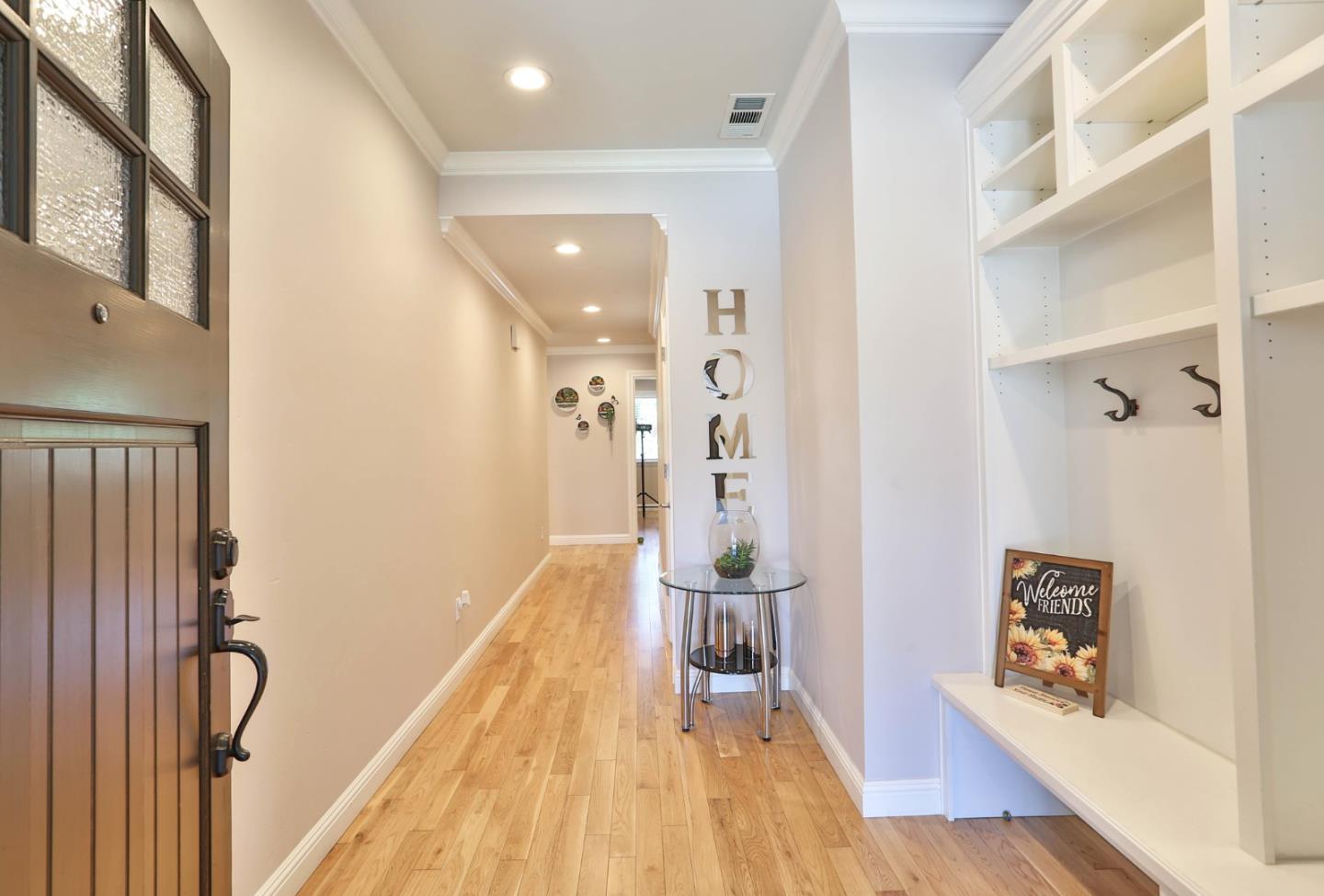 1053 Wallace Drive San Jose, CA 95120 - Photo 10 of 36 a view of a hallway with wooden floor and staircase