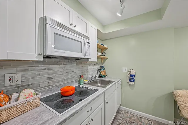 a kitchen with a sink and cabinets