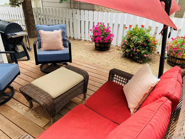 a outdoor living space with furniture and flowers