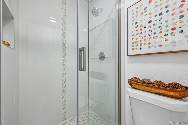 a bathroom with a shower and a sink
