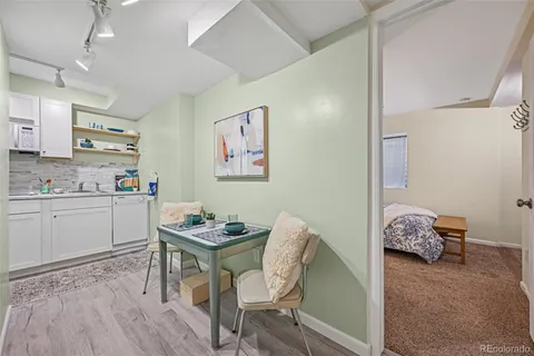 a kitchen with stainless steel appliances a sink and cabinets