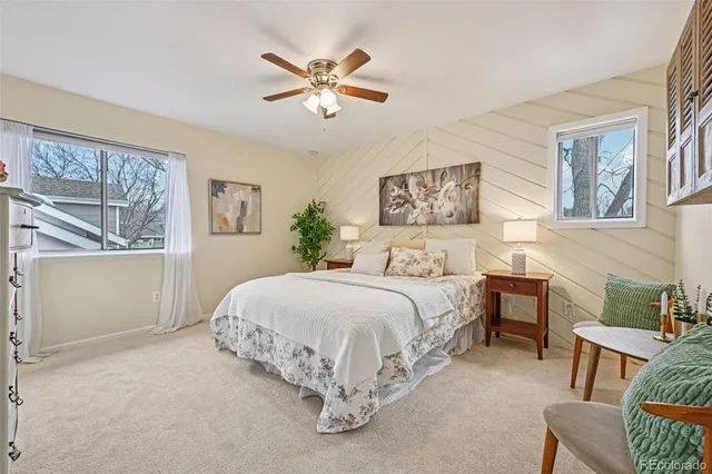 a bed room with a bed and a chair