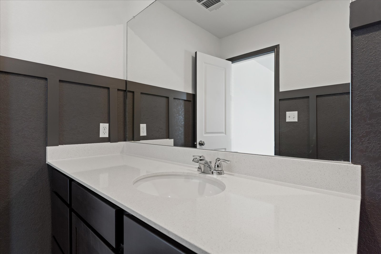 905 Powell Kyle, TX 78640 - Photo 21 of 37 a bathroom with a sink vanity and a mirror
