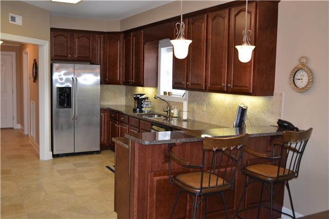 7100 Dale Ridge Road, Unit B3 Lancaster, TN 38569 - Photo 9 of 20 Upscale kitchen has beautiful granite, tile backsplash; stainless steel appliances...and yes, this is at the lake! Wow!