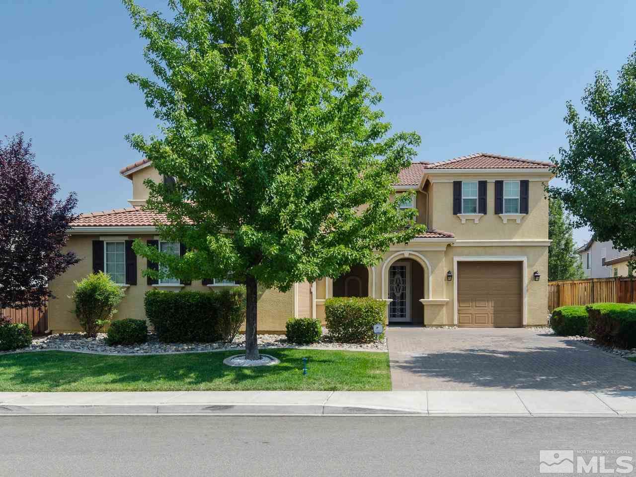 545 Luciana Drive Reno, NV 89521 - Photo 1 of 24 a front view of a house with a garden