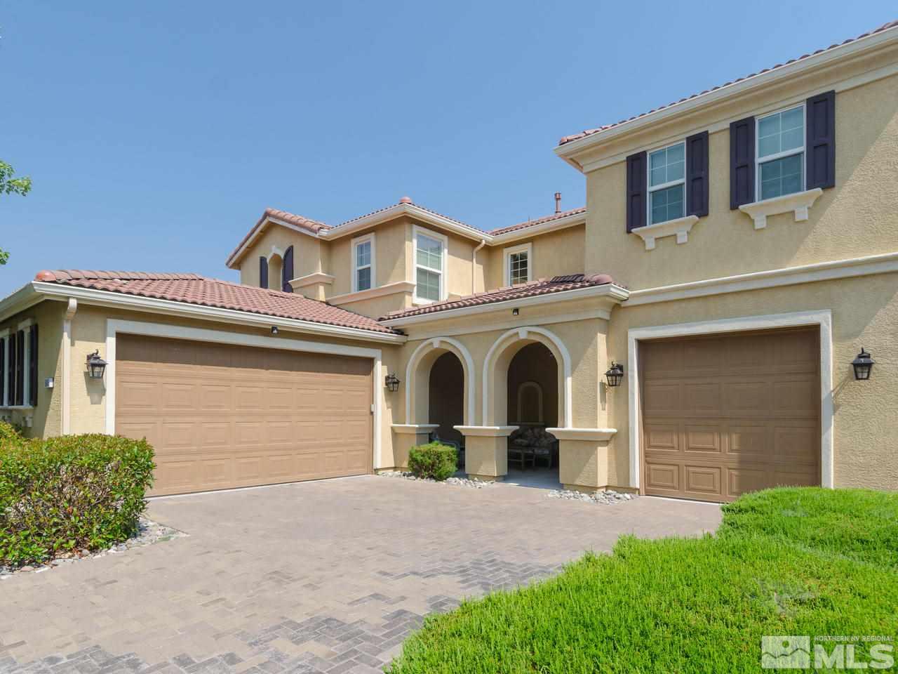 545 Luciana Drive Reno, NV 89521 - Photo 4 of 24 a front view of a house with garden