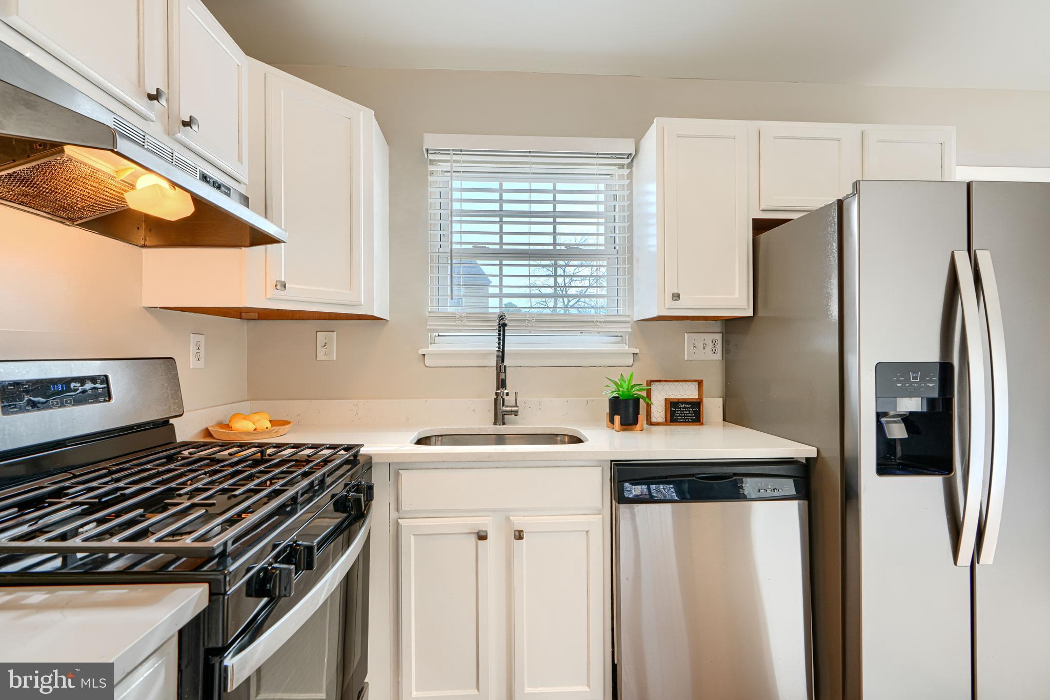 8 King Richard Court, Unit 8 Rosedale, MD 21237 - Photo 14 of 41 a kitchen with stainless steel appliances a sink stove and refrigerator