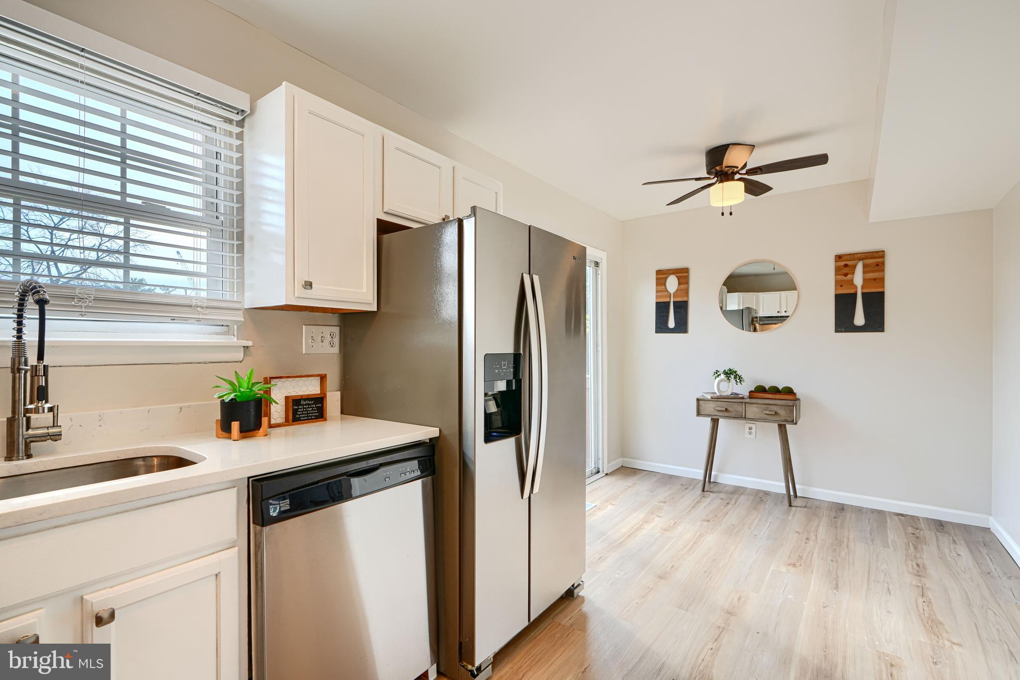 8 King Richard Court, Unit 8 Rosedale, MD 21237 - Photo 15 of 41 a kitchen with a refrigerator a stove a sink and a window