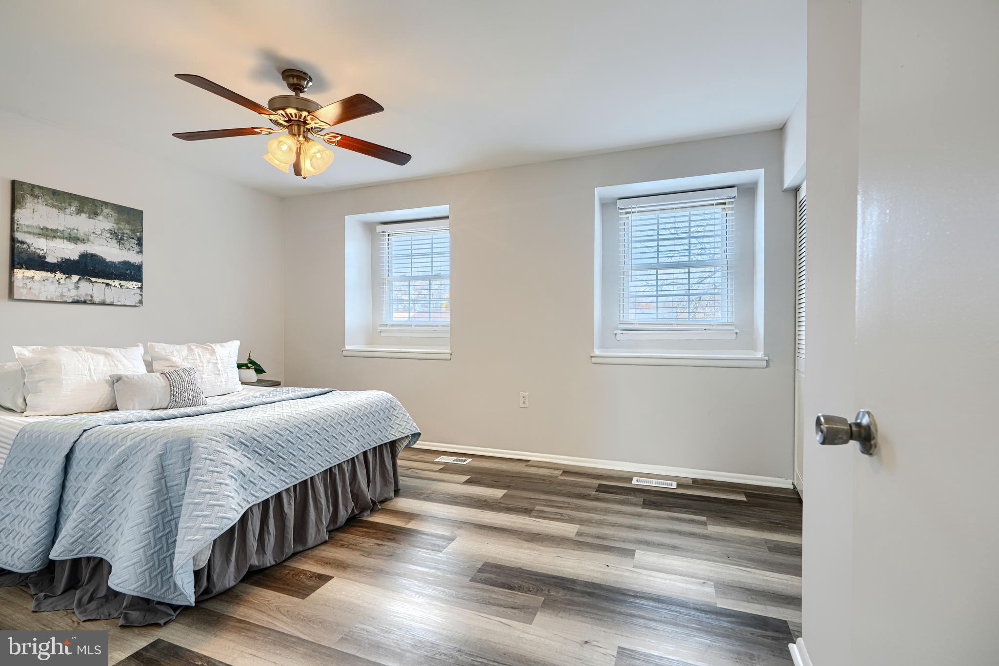 8 King Richard Court, Unit 8 Rosedale, MD 21237 - Photo 18 of 41 a bedroom with a bed and a chandelier