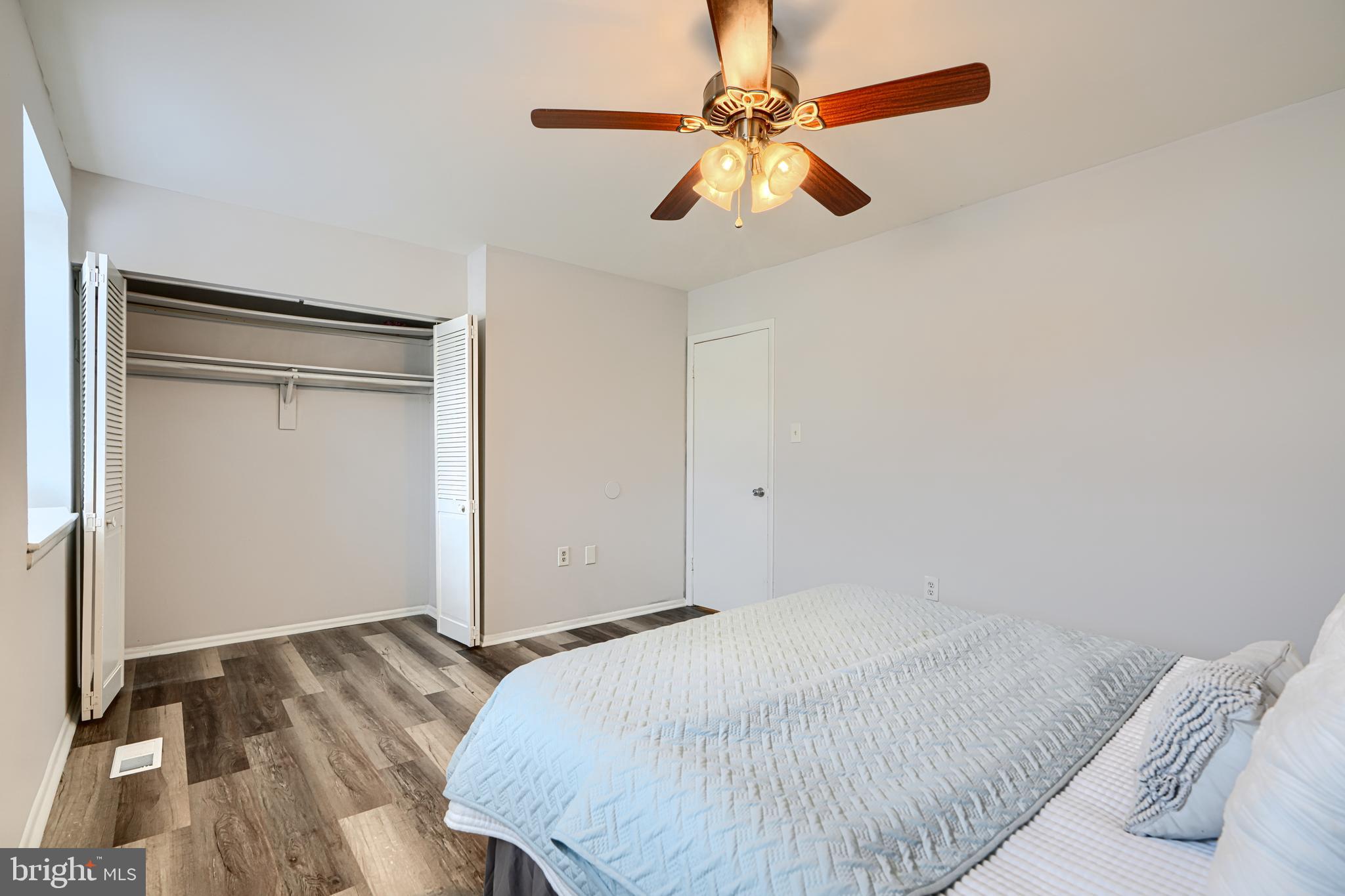 8 King Richard Court, Unit 8 Rosedale, MD 21237 - Photo 21 of 41 a bedroom with a bed and a chandelier