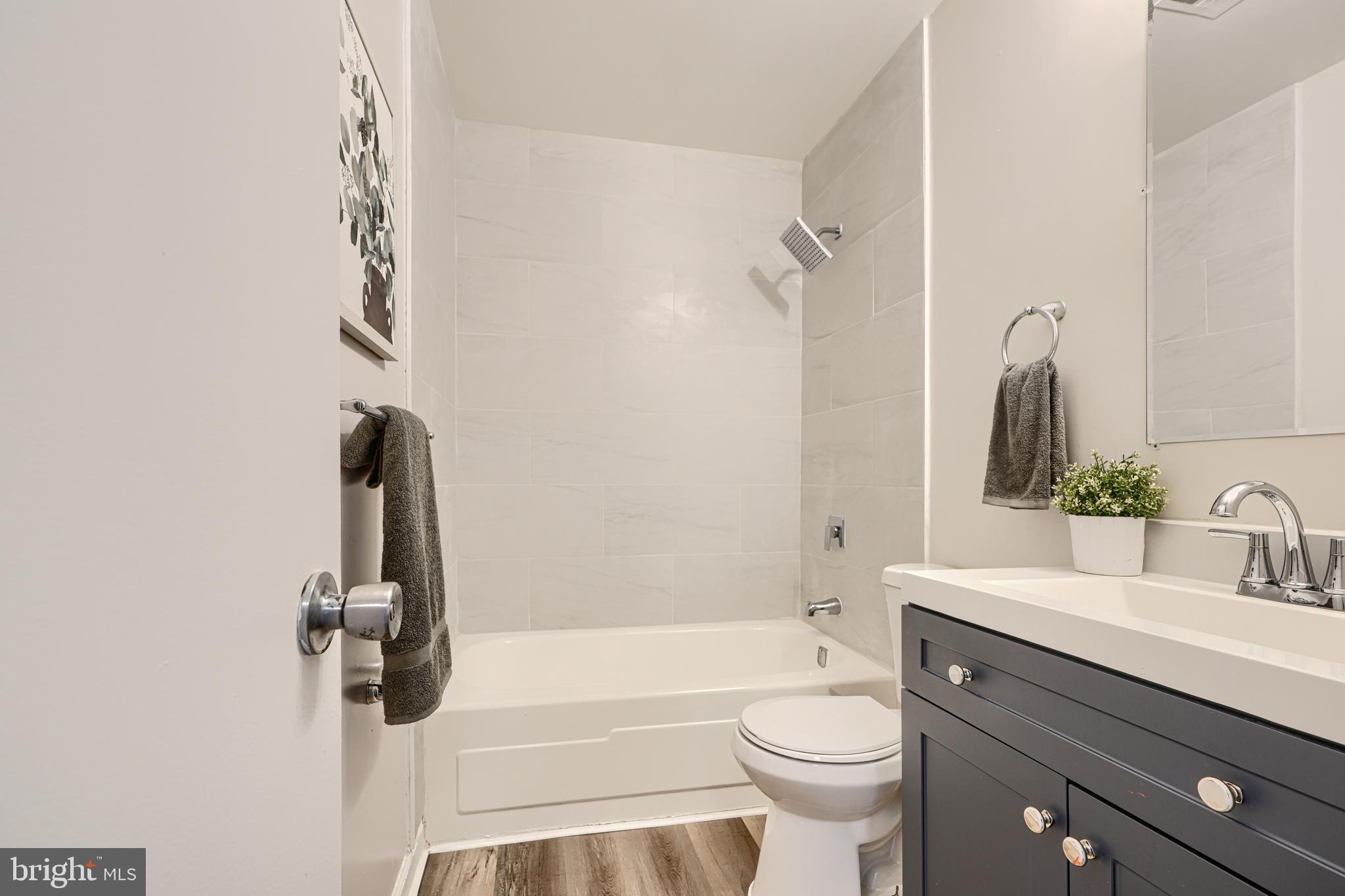 8 King Richard Court, Unit 8 Rosedale, MD 21237 - Photo 22 of 41 a bathroom with a sink a toilet and a bathtub