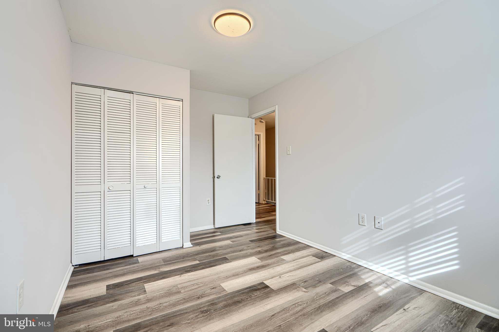 8 King Richard Court, Unit 8 Rosedale, MD 21237 - Photo 27 of 41 a view of a livingroom with wooden floor and closet