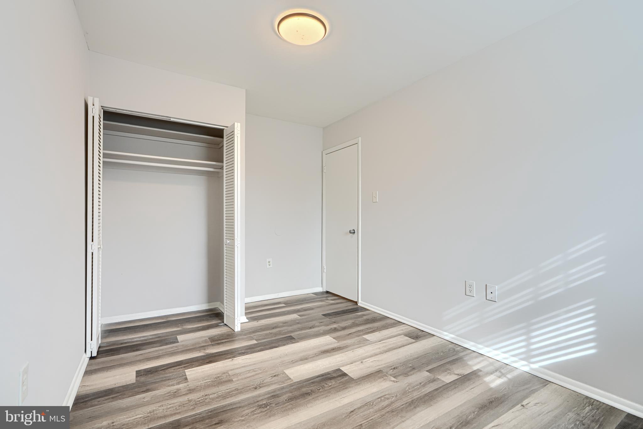 8 King Richard Court, Unit 8 Rosedale, MD 21237 - Photo 28 of 41 a view of a livingroom with wooden floor and closet
