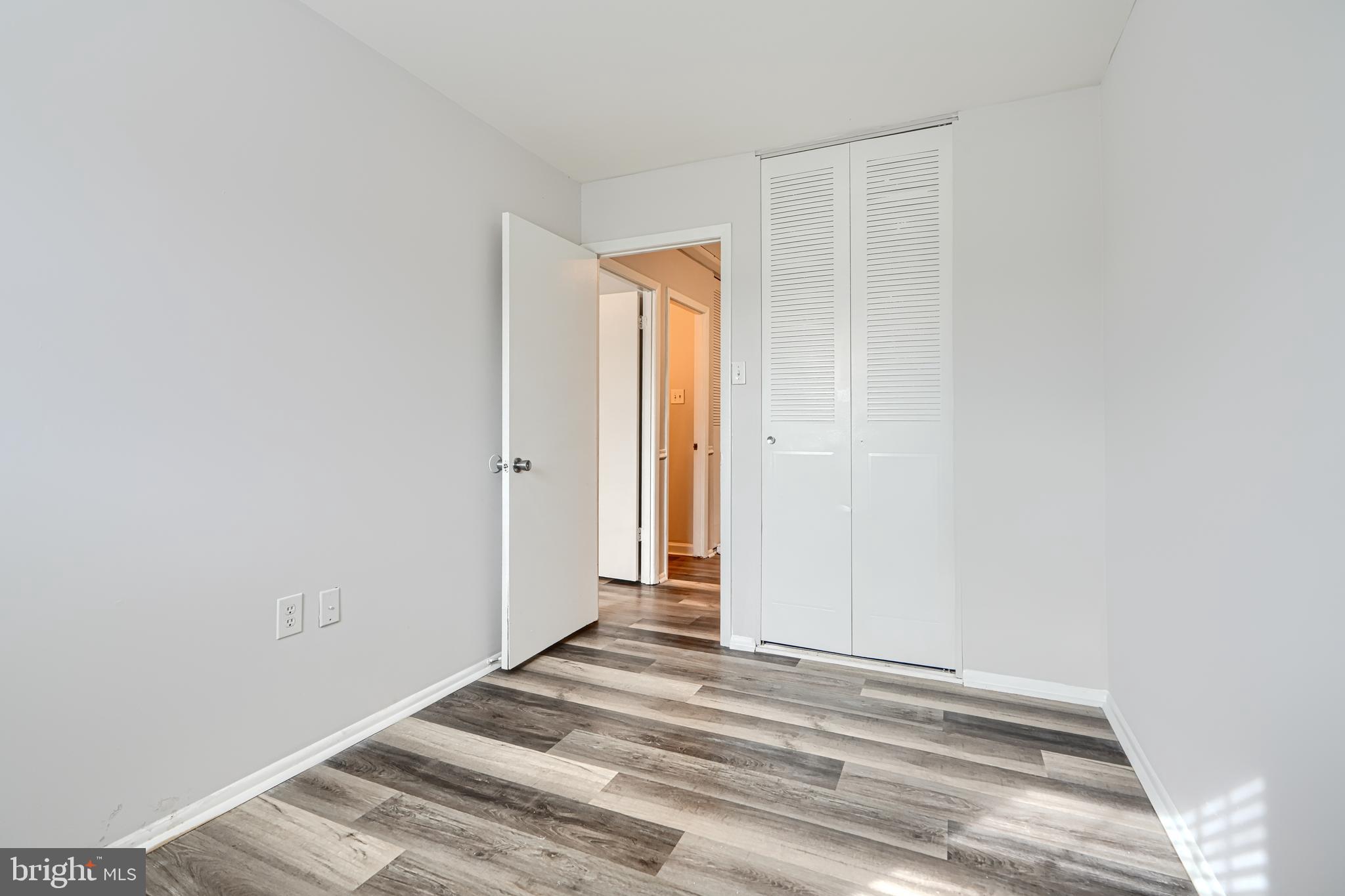 8 King Richard Court, Unit 8 Rosedale, MD 21237 - Photo 31 of 41 a view of a livingroom with wooden floor and a window